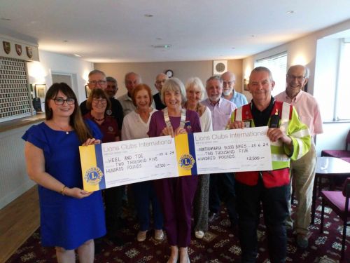 (Front left to right) Jane Long of Heel & Toe, Pat De Martino, President of Darlington Lions, Ken Tait of Northumbria Blood Bikes with (rear) members of Darlington Lions Club.